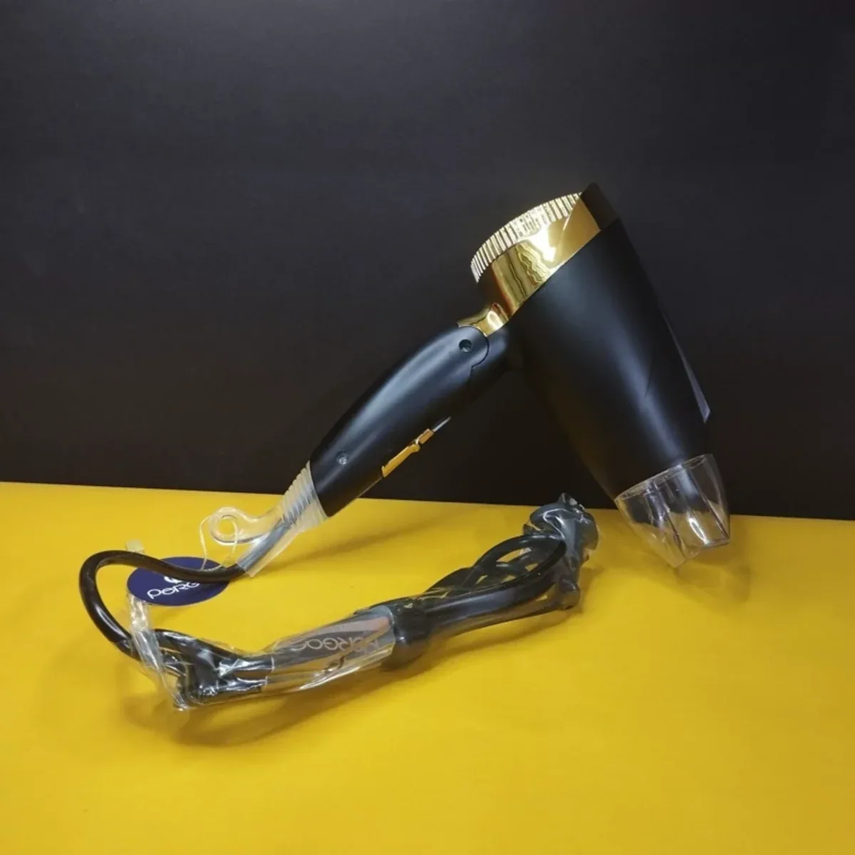 سشوار مسافرتی حرفه‌ای پرگاس Pergas مدل PS-1113 با دسته تاشو، موتور AC و فناوری یون - تصویر ۳